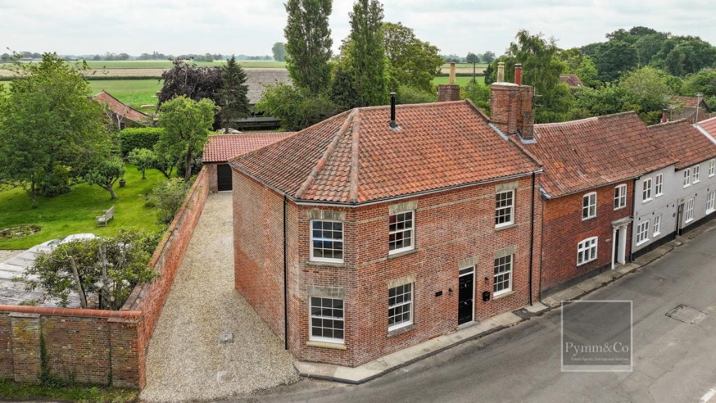 Malthouse refurbishment — aerial view showing red pantile roof, gravel drive and gardens